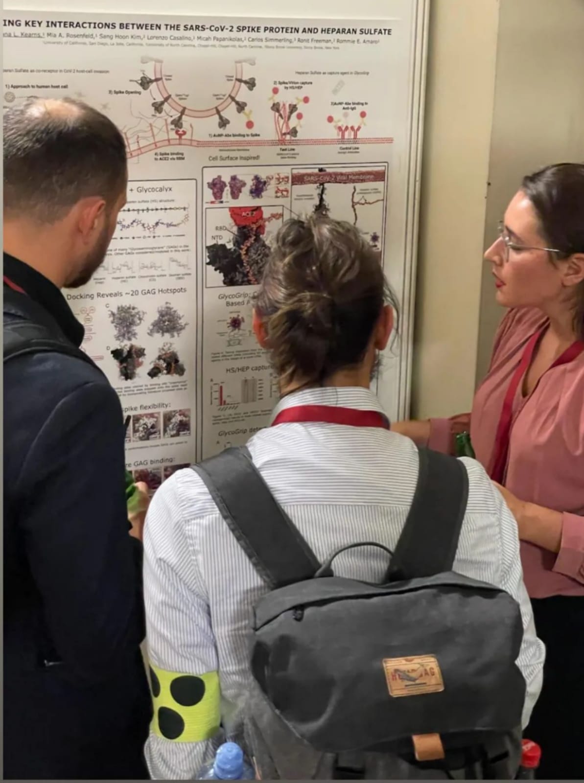 Picture of myself presenting my poster to two other conference attendees.  Picture of myself presenting my poster to two other conference attendees.
